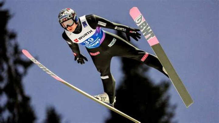 How do ski jumpers get to top?